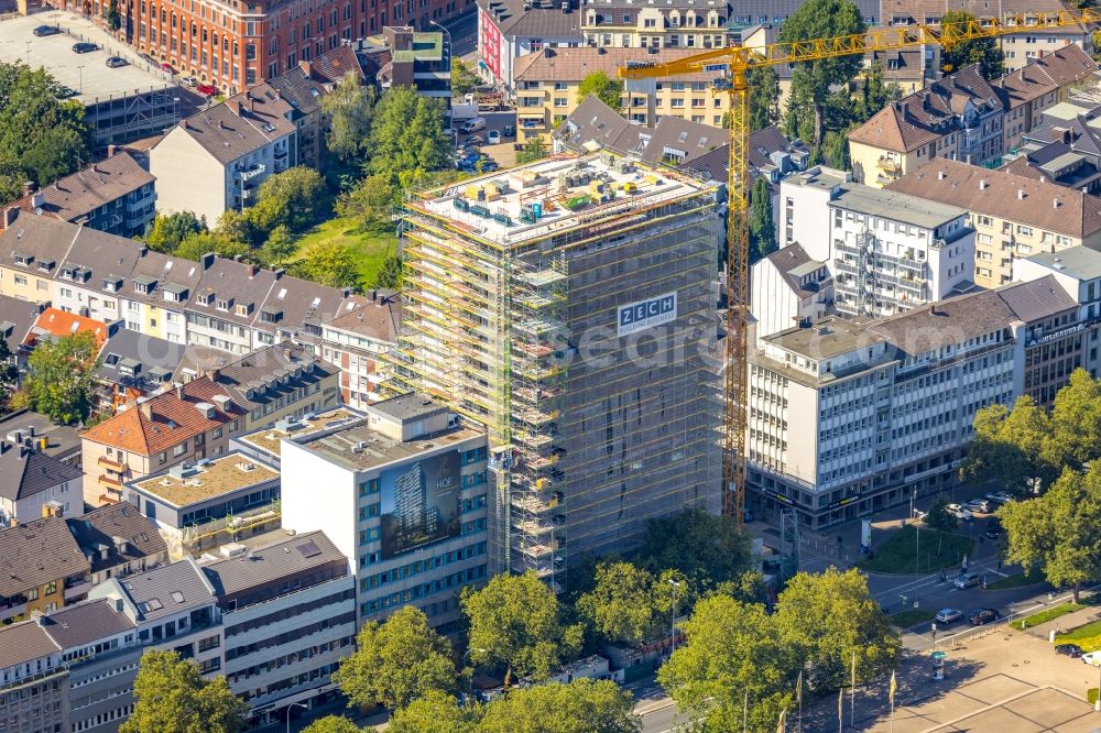 Aerial image Essen - Construction site to build a new residential and commercial building HQE Huyssen Quartier Essen with residential tower and senior citizens' apartments on Huyssenallee - corner of Heinrichstrasse in Essen in the Ruhr area in the state North Rhine-Westphalia, Germany