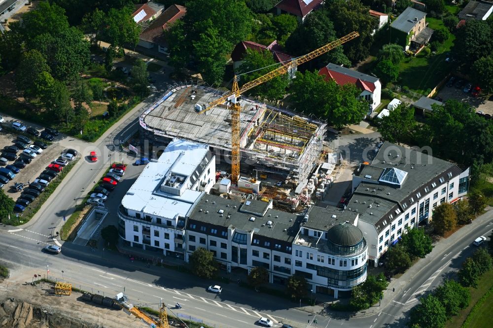 Bernau from the bird's eye view: New construction of a residential and commercial building on Jahnstrasse - Neuer Schulweg - Ladenburger Chaussee in Bernau in the state Brandenburg, Germany