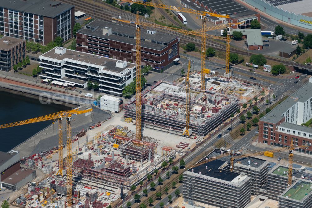 Bremen from the bird's eye view: New construction of a residential and commercial building on Ludwig-Franzius-Platz in Bremen, Germany