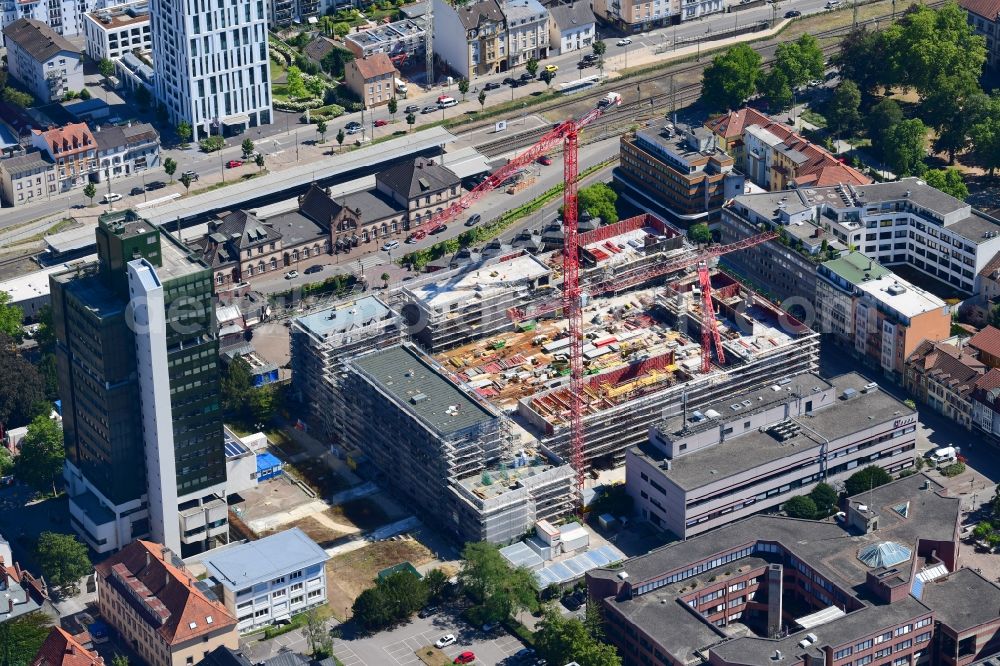 Lörrach from the bird's eye view: New residential and commercial building Quarter Loe on place Bahnhofsplatz - Sarasinweg - Palmstrasse in Loerrach in the state Baden-Wurttemberg, Germany