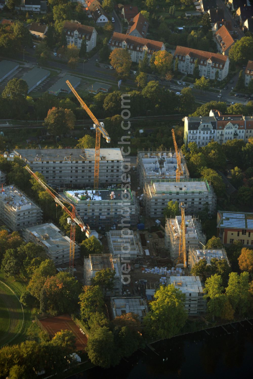 Berlin from above - Construction site residential area of a multi-family house settlement on the bank and river of Spree River on street Bruno-Buergel-Weg in the district Schoeneweide in Berlin, Germany