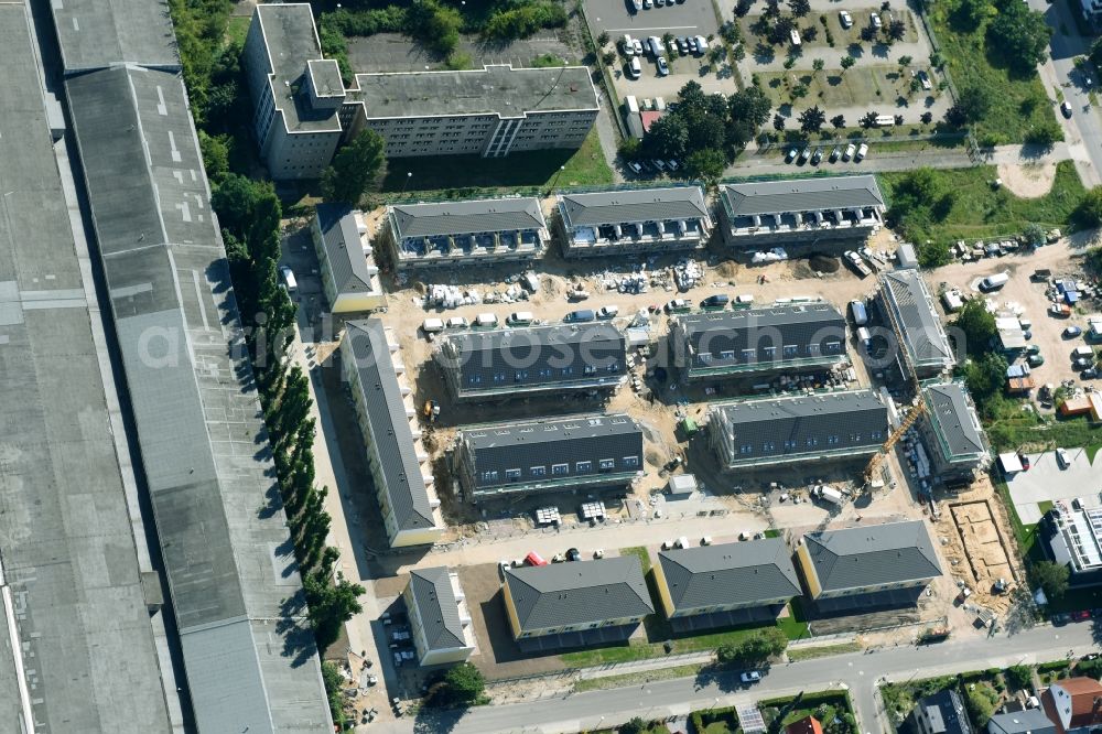 Aerial photograph Berlin - Construction site of a new residential area of the terraced housing estate on the Arendscarree on Arendstrasse corner Lichtenauer Strasse - Schleizer Strasse in the district Hohenschoenhausen in Berlin, Germany