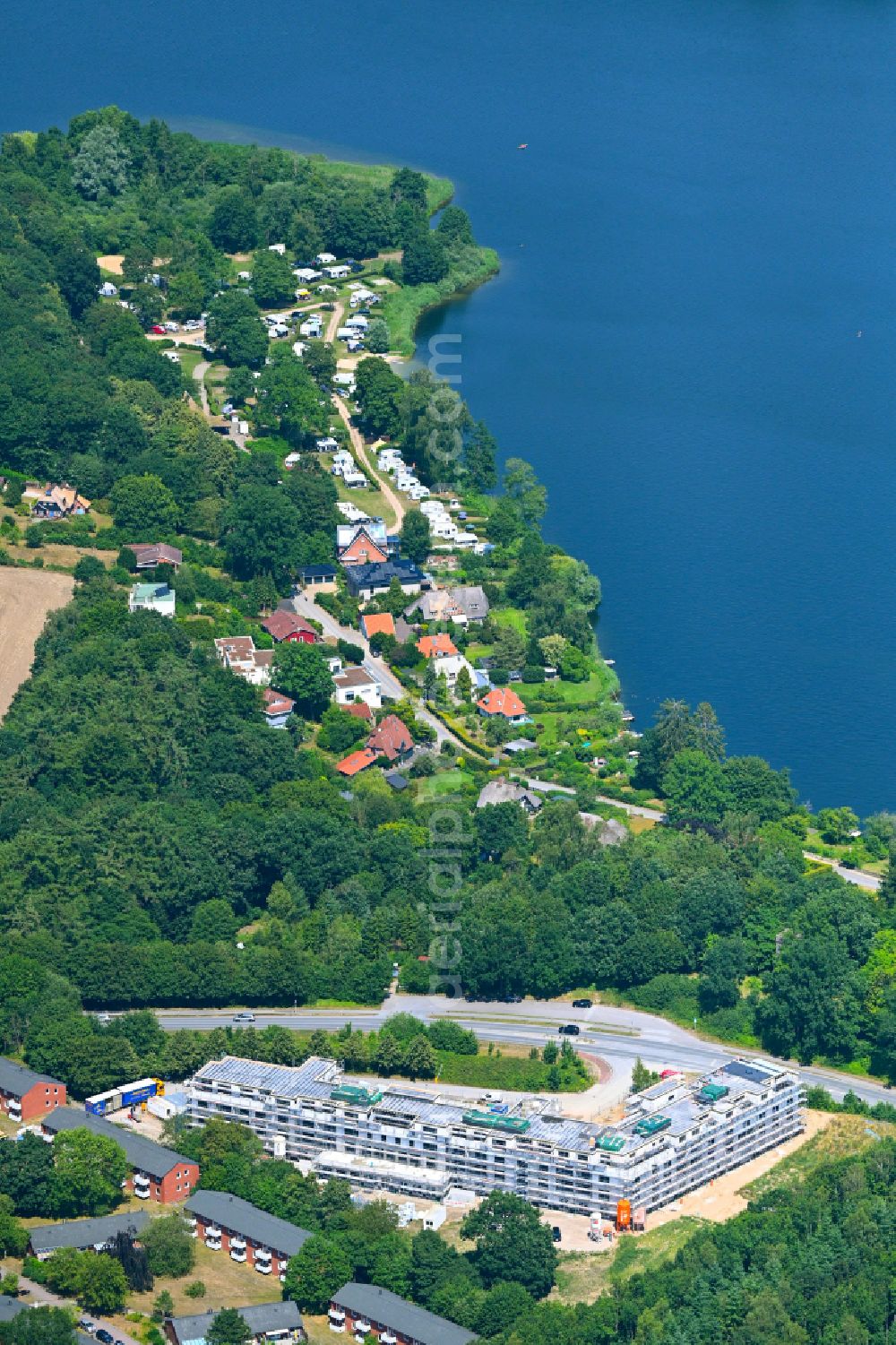 Eutin from the bird's eye view: Construction site of a new residential area of the terraced housing estate Wilhelmshoehe on Convivo-Park on street Malenter Landstrasse in the district Fissau in Eutin in the state Schleswig-Holstein, Germany