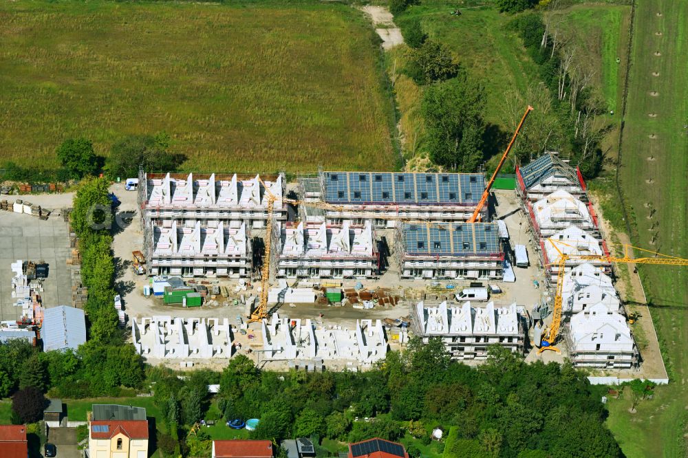 Berlin from the bird's eye view: Construction site of a new residential area of the terraced housing estate in the Pilgramer Strasse in the district Mahlsdorf in Berlin, Germany