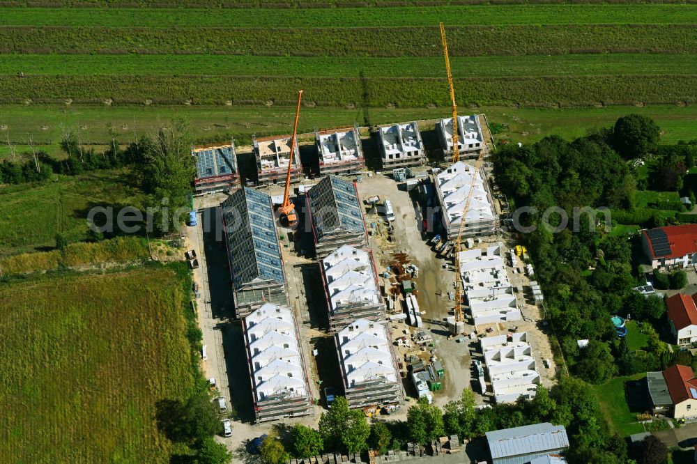 Aerial image Berlin - Construction site of a new residential area of the terraced housing estate in the Pilgramer Strasse in the district Mahlsdorf in Berlin, Germany