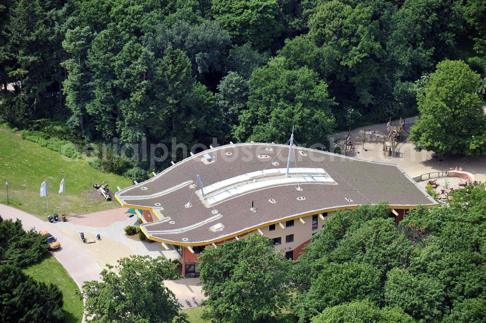 Aerial photograph Magdeburg - Blick auf den Neubau Zoowelle, den Hauptein- und ausgang des Magdeburger Zoos. Das Bauwerk mit dem rechts angrenzenden Erdmännchengehege wurde 2009 eröffnet. Look at the new Zoowelle, the main entrance and exit of the Magdeburg Zoo. The building with the adjacent right Erdmännchengehege was opened in 2009.