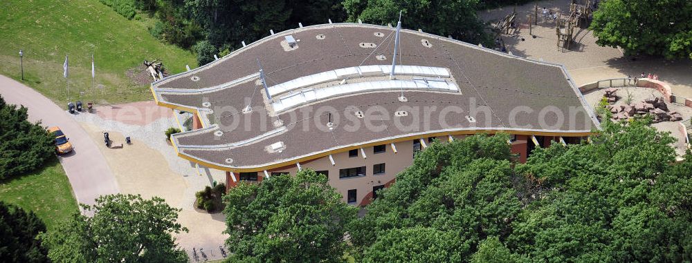 Magdeburg from the bird's eye view: Blick auf den Neubau Zoowelle, den Hauptein- und ausgang des Magdeburger Zoos. Das Bauwerk mit dem rechts angrenzenden Erdmännchengehege wurde 2009 eröffnet. Look at the new Zoowelle, the main entrance and exit of the Magdeburg Zoo. The building with the adjacent right Erdmännchengehege was opened in 2009.