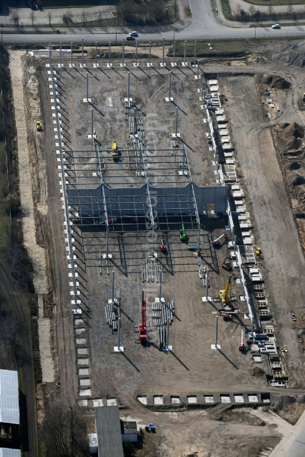 Aerial image Hoppegarten - Construction site with piling works for the foundation slab of a new building einer Logistikhalle der Hoppegarten Park Property GmbH & Co.KG an der Industriestrasse in Hoppegarten in the state Brandenburg