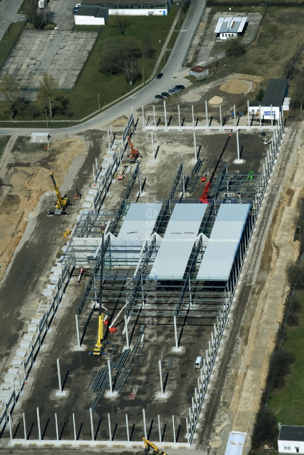 Aerial photograph Hoppegarten - Construction site with piling works for the foundation slab of a new building einer Logistikhalle der Hoppegarten Park Property GmbH & Co.KG an der Industriestrasse in Hoppegarten in the state Brandenburg