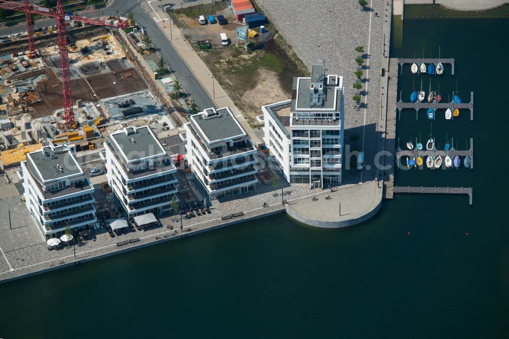 Aerial image Dortmund - New residential buildings at the lake Phoenixsee beneath the roads Hoerder-Bach-Allee and Am Kai in Dortmund in North Rhine-Westphalia