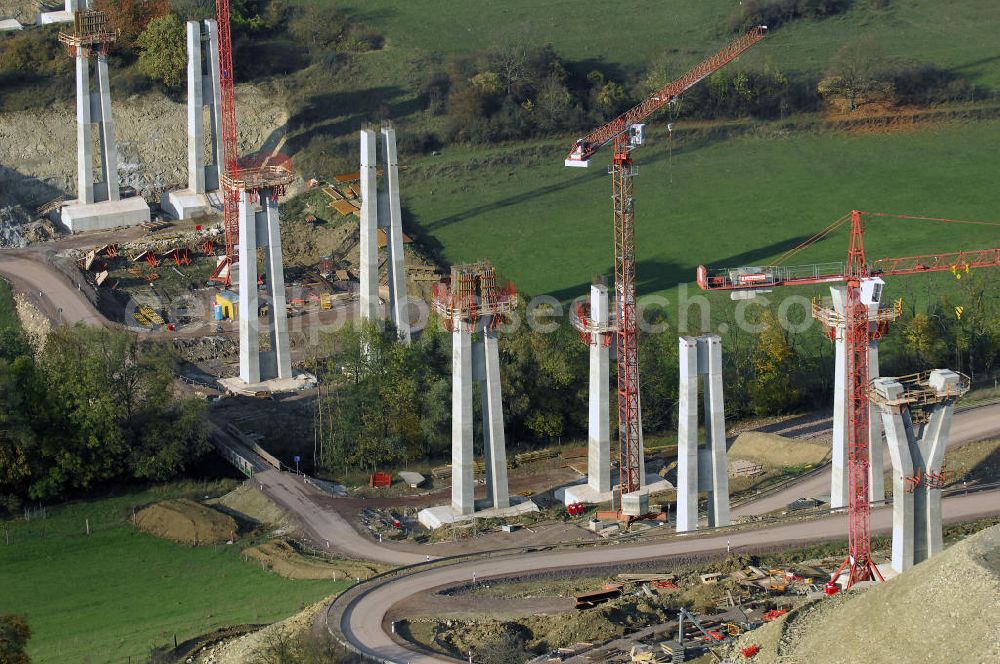 ETTENHAUSEN an der Nesse from the bird's eye view: Baustellen an der Neubautrasse der BAB A 4 - Umfahrung Hörselberge in Thüringen bei Eisenach. Das Bieterkonsortium VINCI Concessions / Hochtief PPP (50/50) hat den Zuschlag für das A-Modell BAB A 4 Umfahrung Hörselberge (km 238,5 bis km 283,2) erhalten. Die bei diesem Projekt auf der Bauausführungsebene gegründete Arbeitsgemeinschaft wird von der EUROVIA Infra GmbH angeführt, des Weiteren sind hier die Unternehmen Hochtief, Strassing Limes und Rädlinger beteiligt. Durchgeführt werden die im Zuge dieses Projektes notwendigen Arbeiten unter an derem von den Mitarbeitern der Niederlassung Weimar der EUROVIA Verkehrsbau Union sowie der Niederlassungen Abbruch und Erdbau, Betonstraßenbau, Ingenieurbau und TECO Schallschutz der EUROVIA Beton. DEGES; STREIF Baulogistik.