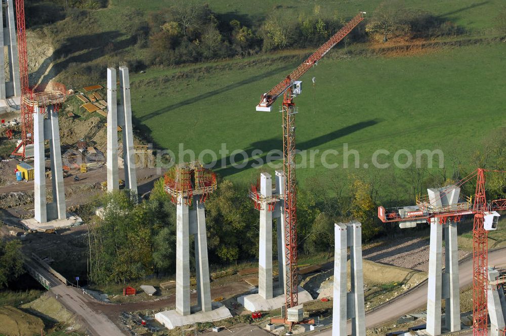 Aerial photograph ETTENHAUSEN an der Nesse - Baustellen an der Neubautrasse der BAB A 4 - Umfahrung Hörselberge in Thüringen bei Eisenach. Das Bieterkonsortium VINCI Concessions / Hochtief PPP (50/50) hat den Zuschlag für das A-Modell BAB A 4 Umfahrung Hörselberge (km 238,5 bis km 283,2) erhalten. Die bei diesem Projekt auf der Bauausführungsebene gegründete Arbeitsgemeinschaft wird von der EUROVIA Infra GmbH angeführt, des Weiteren sind hier die Unternehmen Hochtief, Strassing Limes und Rädlinger beteiligt. Durchgeführt werden die im Zuge dieses Projektes notwendigen Arbeiten unter an derem von den Mitarbeitern der Niederlassung Weimar der EUROVIA Verkehrsbau Union sowie der Niederlassungen Abbruch und Erdbau, Betonstraßenbau, Ingenieurbau und TECO Schallschutz der EUROVIA Beton. DEGES; STREIF Baulogistik.