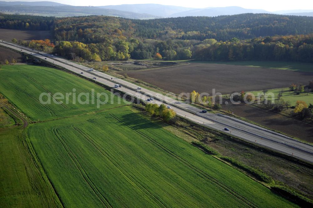 SÄTTELSTÄDT from the bird's eye view: Baustellen zur Verlegung der E40 / A4 an der Neubautrasse Umfahrung Hörselberge in Thüringen bei Eisenach. Das Bieterkonsortium VINCI Concessions / Hochtief PPP (50/50) hat den Zuschlag für das A-Modell BAB A 4 Umfahrung Hörselberge (km 238,5 bis km 283,2) erhalten. Die bei diesem Projekt auf der Bauausführungsebene gegründete Arbeitsgemeinschaft wird von der EUROVIA Infra GmbH angeführt, des Weiteren sind hier die Unternehmen Hochtief, Strassing Limes und Rädlinger beteiligt. Durchgeführt werden die im Zuge dieses Projektes notwendigen Arbeiten unter an derem von den Mitarbeitern der Niederlassung Weimar der EUROVIA Verkehrsbau Union sowie der Niederlassungen Abbruch und Erdbau, Betonstraßenbau, Ingenieurbau und TECO Schallschutz der EUROVIA Beton. DEGES; STREIF Baulogistik.