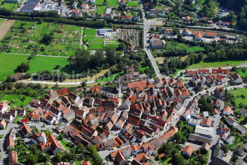 Neudenau from the bird's eye view: Blick auf Neudenau. Die Stadt liegt im Landkreis Heilbronn an der Jagst in Baden-Württemberg. In der Mitte des Bildes ist die Pfarrkirche St. Laurentius zu sehen. Sie ist eine katholische, barocke Kirche und geht auf ein wesentlich älteres gotisches Vorgängerbauwerk zurück. Kontakt: Stadtverwaltung Neudenau Rathaus Siglingen, Bürgermeister Manfred Hebeiß, Heilbronner Straße 29 74861 Neudenau-Siglingen, Tel. +49(0)6298 92716 0, Fax +49(0)6298 92716 49, Email: zentrale@neudenau.de