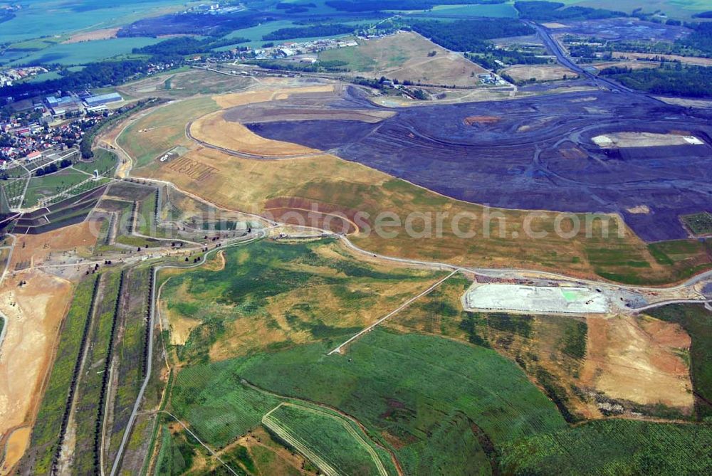 Aerial image Ronneburg - - Auf dem Ronneburger Gelände der Bundesgartenschau 2007 (Buga), einem ehemaligen Uranabbaugebiet der Wismut, gibt es keine gefährliche radioaktive Strahlung mehr. Das ist das Ergebnis einer Expertise des Öko-Instituts Darmstadt. Die Gartenschau soll vom 27. April 2007 an mindestens 1,5 Millionen Besucher nach Gera und Ronneburg locken. Die unabhängigen Ingenieure analysierten Messwerte, die in den vergangenen Jahren von der Wismut und an deren Institutionen erhoben wurden.