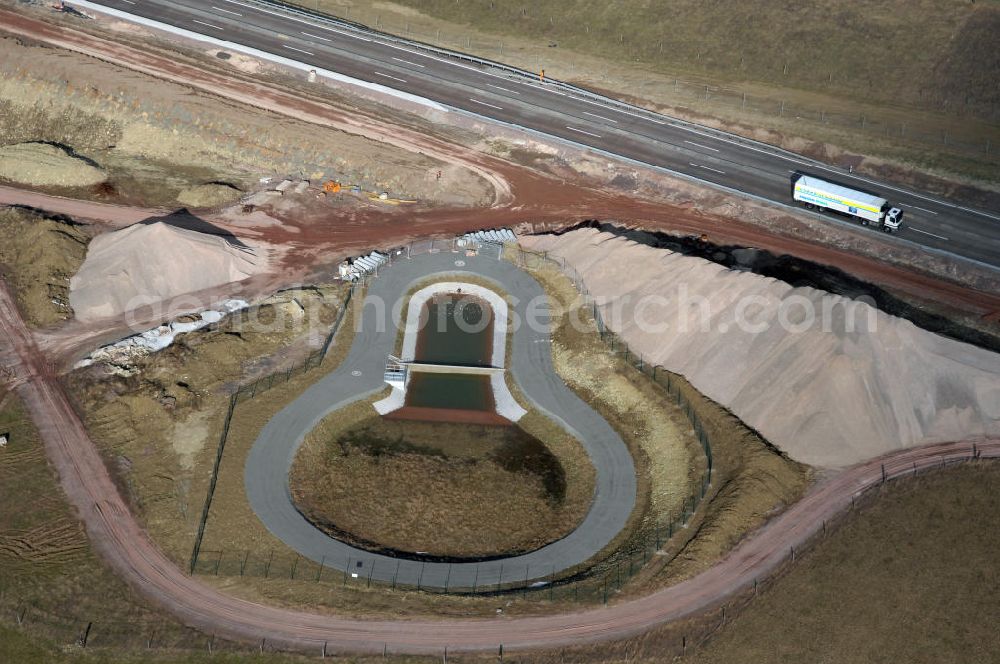 Ettenhausen from the bird's eye view: Blick auf die neue Nessetalbrücke mit einer Länge von 380 m und einem Regenrückhaltebecken nach der teilweisen Verkehrsfreigabe der A4 / E40. Die Brücke ist Teil des Projekt Nordverlegung / Umfahrung Hörselberge der Autobahn E40 / A4 in Thüringen bei Eisenach. Durchgeführt werden die im Zuge dieses Projektes notwendigen Arbeiten durch die EUROVIA Verkehrsbau Union sowie der Niederlassungen Abbruch und Erdbau, Betonstraßenbau, Ingenieurbau und TECO Schallschutz der EUROVIA Beton sowi???????????????????????????????????????????????????????????????????????????????????????????????