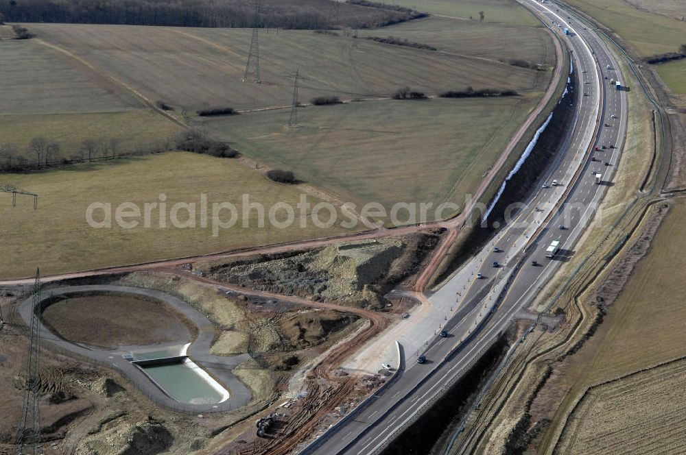 Aerial photograph Ettenhausen - Blick auf die neue Nessetalbrücke mit einer Länge von 380 m und einem Regenrückhaltebecken nach der teilweisen Verkehrsfreigabe der A4 / E40. Die Brücke ist Teil des Projekt Nordverlegung / Umfahrung Hörselberge der Autobahn E40 / A4 in Thüringen bei Eisenach. Durchgeführt werden die im Zuge dieses Projektes notwendigen Arbeiten durch die EUROVIA Verkehrsbau Union sowie der Niederlassungen Abbruch und Erdbau, Betonstraßenbau, Ingenieurbau und TECO Schallschutz der EUROVIA Beton sowi???????????????????????????????????????????????????????????????????????????????????????????????