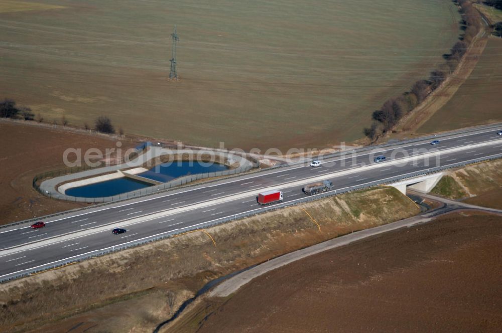 Hötzelsroda from above - Blick auf den neuen E40 / A4 - Autobahnverlauf in Thüringen nach der teilweisen Verkehrsfreigabe. Durchgeführt werden die im Zuge dieses Projektes notwendigen Arbeiten unter an derem von EUROVIA Verkehrsbau Union sowie der Niederlassungen Abbruch und Erdbau, Betonstraßenbau, Ingenieurbau und TECO Schallschutz der EUROVIA Beton sowie der DEGES. View of the new A4 motorway course E40 / A4 near Hötzelsroda in thuringia