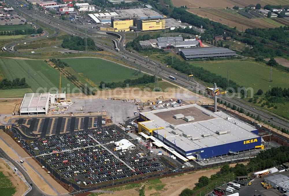 Aerial photograph Koblenz - : Neueröffnung des ersten IKEA Möbel-Kompetenz-Zentrum in Deutschland auf insgesamt 115.000 Quadratmetern Grundstücksfläche.In den Zentren haben Einzelhändler rund um das Thema „Wohnen“ die Möglichkeit, Verkaufsflächen anzumieten. Es werden zusätzliche 150 Arbeitsplätze geschaffen. Als erster Partner von IKEA wird die Firma Saturn Ende Oktober 2006 einen Markt eröffnen. Die gesamten Investitionskosten in das Möbel-Kompetenz-Zentrum betragen ca. 45 Mio. Euro. Es werden ca. 2.075 Parkplätze für Kunden zur Verfügung stehen. Weitere Zentren sind unter an derem in Würzburg, Köln und Bremen geplant.