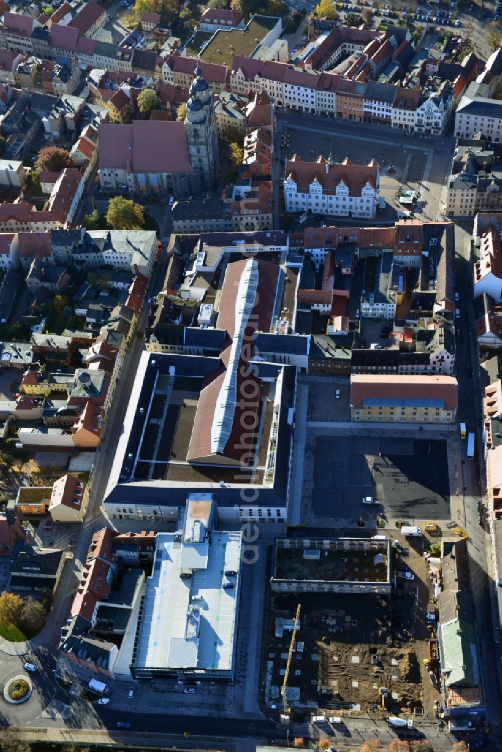 Aerial photograph Wittenberg - View of the construction site of the shopping center Arsenal between the Arsenal square and the market place in the inner city of Wittenberg. Project developers are MIB AG and the OFB Development GmbH