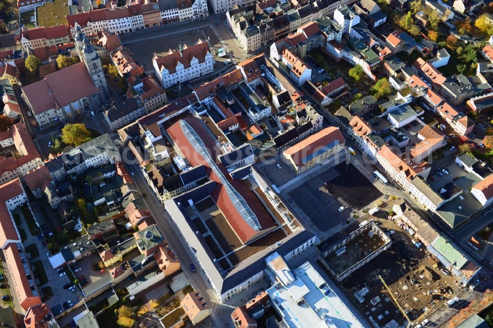 Wittenberg from the bird's eye view: View of the construction site of the shopping center Arsenal between the Arsenal square and the market place in the inner city of Wittenberg. Project developers are MIB AG and the OFB Development GmbH