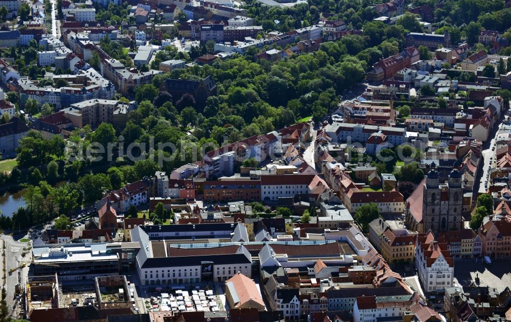 Wittenberg from the bird's eye view: View of the construction site of the shopping center Arsenal between the Arsenal square and the market place in the inner city of Wittenberg. Project developers are MIB AG and the OFB Development GmbH