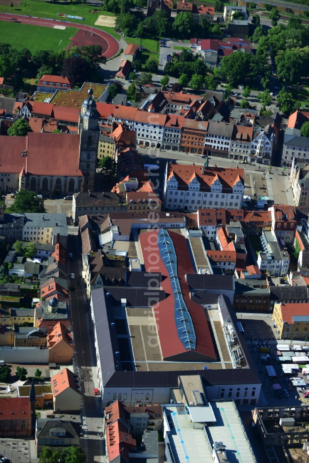 Wittenberg from the bird's eye view: View of the construction site of the shopping center Arsenal between the Arsenal square and the market place in the inner city of Wittenberg. Project developers are MIB AG and the OFB Development GmbH