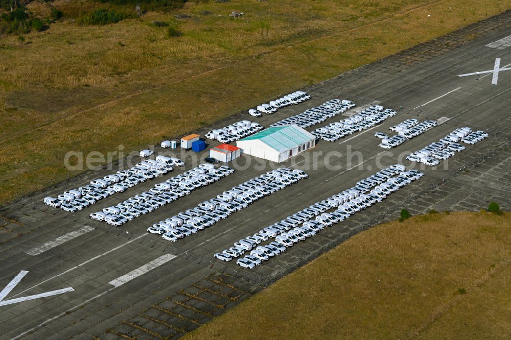 Werneuchen from above - Automobiles - passenger cars on the parking areas in the open-air area of a vehicle reconditioner and converter on a closed area of the runway of the airfield in the district of Hirschfelde in Werneuchen in the federal state of Brandenburg, Germany