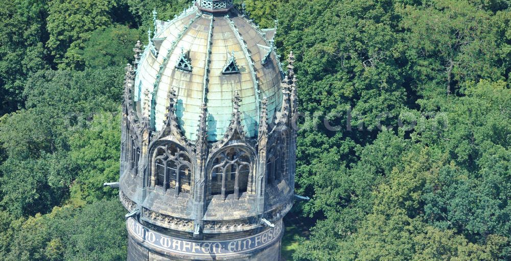 Aerial image Wittenberg - Der Neugotischer Turm der Schlosskirche zu Wittenberg. Das Schloss mit seinem 88 m hohen neugotischen Kirchturm am westlichen Ende der Stadt zählt zum wichtigsten UNESCO-Weltkulturerbe. Die erste Erwähnung der Burg stammt von 1187. Berühmtheit erlangte sie, als am 31. Oktober 1517 der bis dahin nahezu unbekannte Wittenberger Augustinermönch und Theologieprofessor Martin Luther seine 95 lateinischen Disputationsthesen verbreitete. Heute befinden sich im Schloss eine Jugendherberge, das Riemer-Museum und die stadtgeschichtlichen Sammlungen. Tower of the Castle Church of Wittenberg.