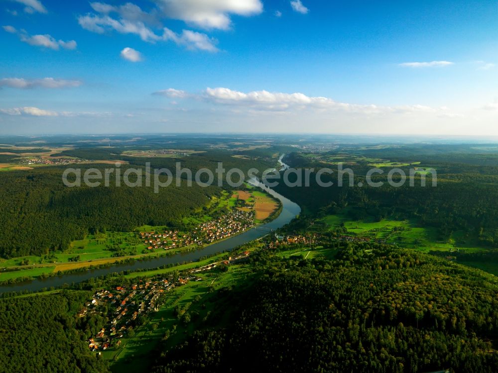 Neustadt am Main from the bird's eye view: Neustadt am Main in the Lower Franconia region of the state of Bavaria. The borough consists of four districts of which Neustadt with the Aurora and Margarethenhof districts lies in the West and Erlach am Main on the Eastern riverbank of the river Main. The community is located in a valley surrounded by forest and fields. In Neustadt there is the highest mountain of the Main-Spessart region, the Klosterkuppel mountain with a height of 552m