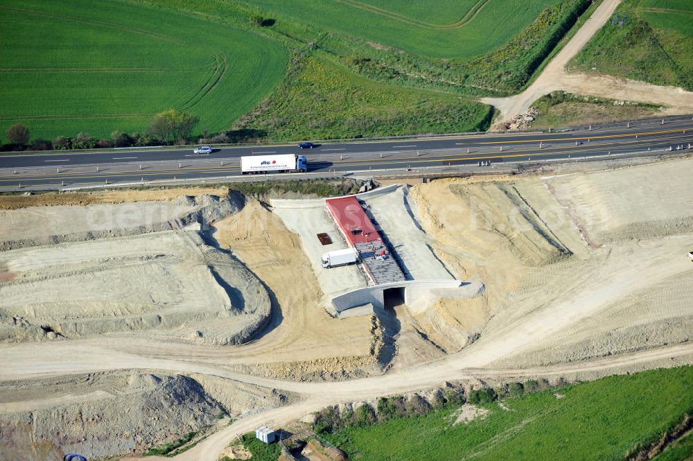 Aerial photograph Magdala - Blick auf die Bauarbeiten zur Neutrassierung / Verlegung der Bundesautobahn BAB A4 zwischen den Anschlussstellen AS Magdala und Jena/Göschwitz. Bauherr des sechstreifiger Neubau des Autobahnabschnittes ist die DEGES Deutsche Einheit Fernstraßenplanungs- und -bau GmbH. Construction work on the realignment / relocation of the federal motorway A4 motorway between junctions AS Magdalene and Jena / Göschwitz. Die Ingenieurgruppe BEB ist mit der Projektsteuerung beauftragt.