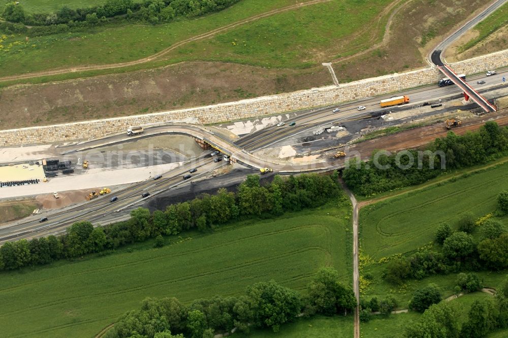 Magdala from the bird's eye view: Blick auf die Bauarbeiten zur Neutrassierung / Verlegung der Bundesautobahn BAB A4 zwischen den Anschlussstellen AS Magdala und Jena/Göschwitz. Bauherr des sechstreifiger Neubau des Autobahnabschnittes ist die DEGES Deutsche Einheit Fernstraßenplanungs- und -bau GmbH. Construction work on the realignment / relocation of the federal motorway A4 motorway between junctions AS Magdalene and Jena / Göschwitz. Die Ingenieurgruppe BEB ist mit der Projektsteuerung beauftragt.