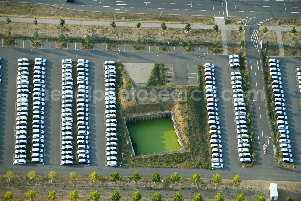 Aerial image Schönefeld - Parking and storage space for automobiles along the Schoenfelder Allee in Schoenefeld in the state Brandenburg, Germany