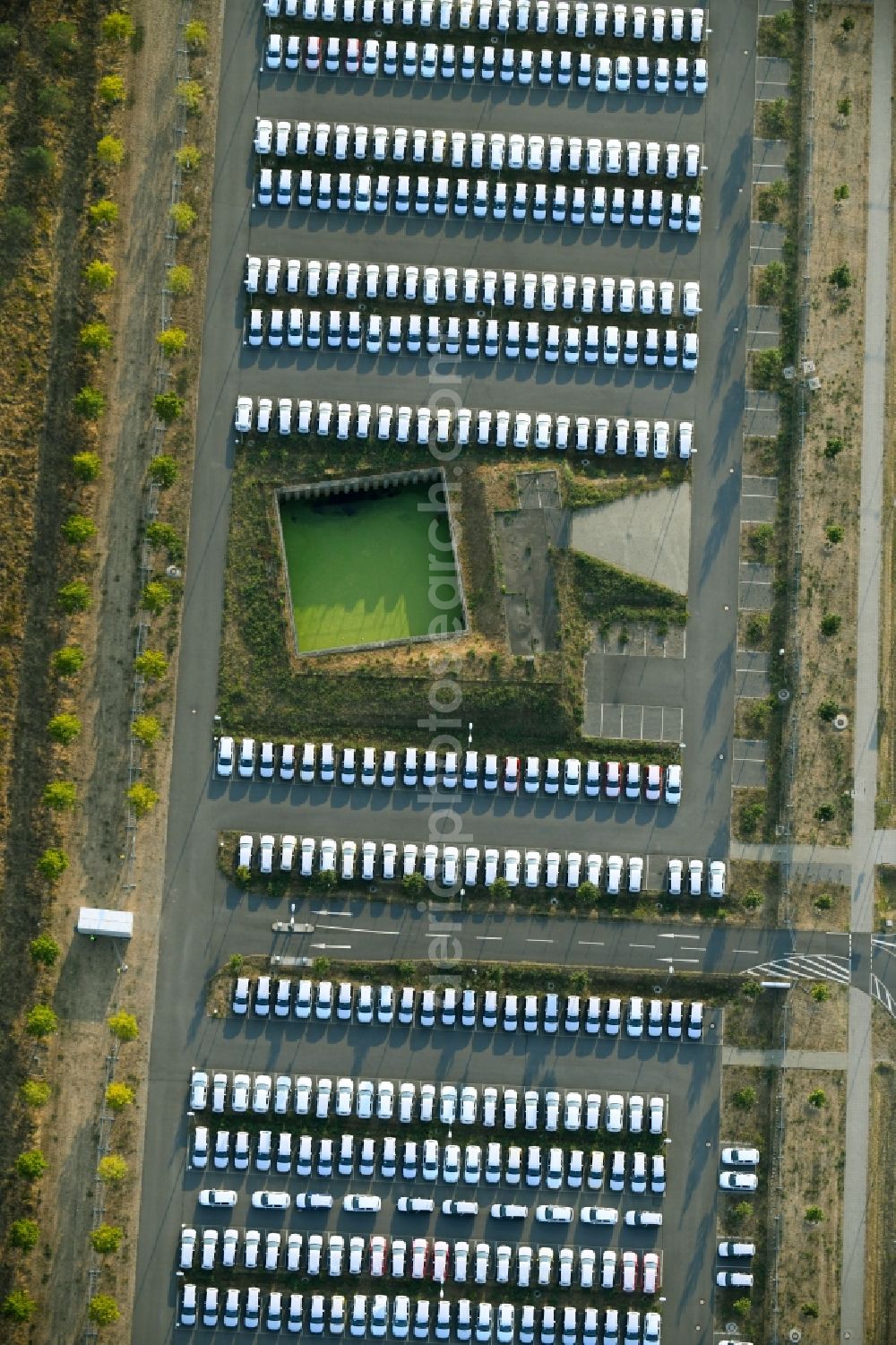 Schönefeld from above - Parking and storage space for automobiles along the Schoenfelder Allee in Schoenefeld in the state Brandenburg, Germany