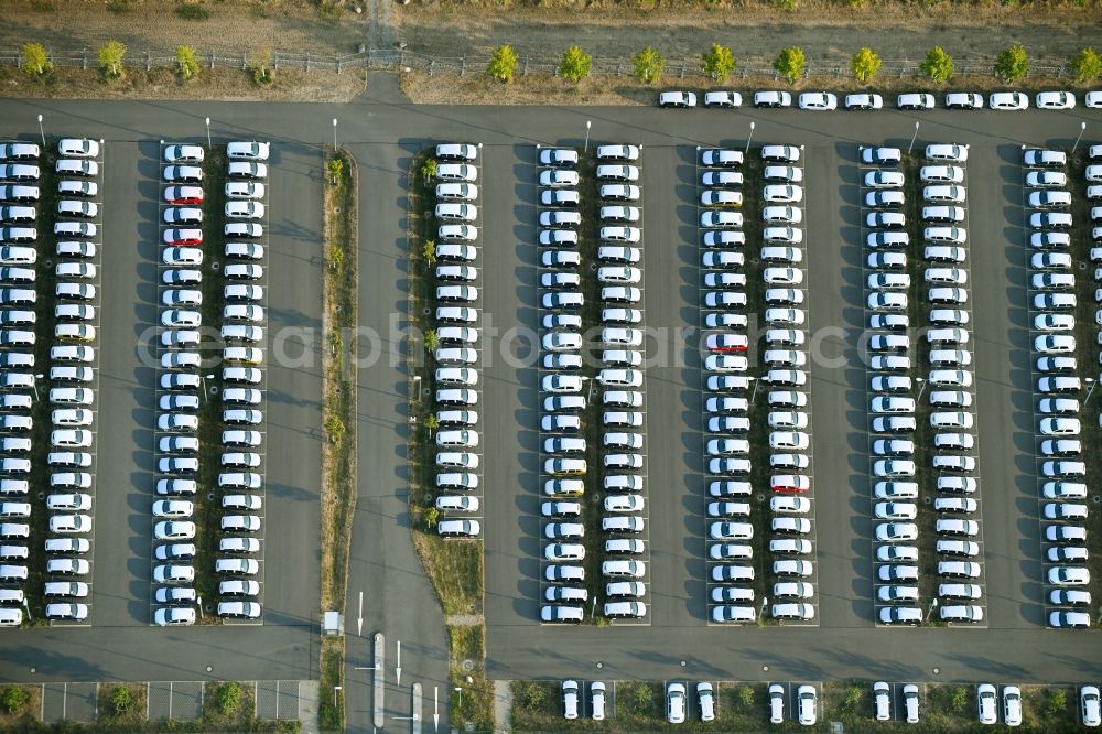 Aerial image Schönefeld - Parking and storage space for automobiles along the Schoenfelder Allee in Schoenefeld in the state Brandenburg, Germany