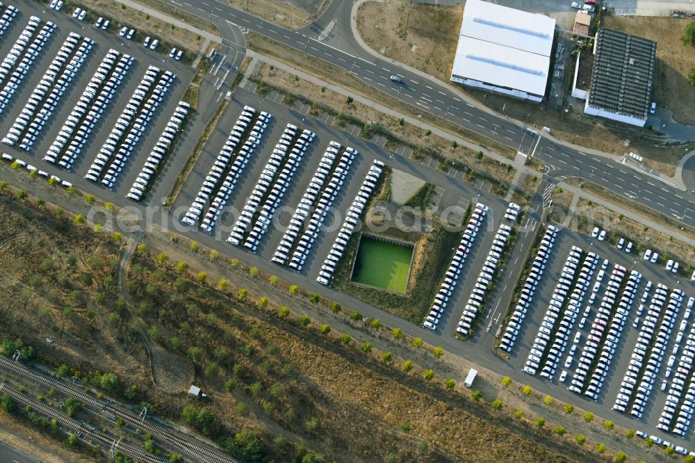 Schönefeld from above - Parking and storage space for automobiles along the Schoenfelder Allee in Schoenefeld in the state Brandenburg, Germany