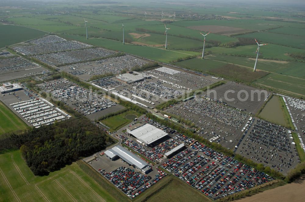 ETZIN from the bird's eye view: Blick auf ( trotz Abwrackprämie ) Neuwagenhalden auf dem Gelände der MOSOLF - Autoservice GmbH in Etzin. Auto-Service u. Umschlag-Center Mosolf GmbH Etzin, 14641 Etzin,Tel.: 033233-88260, 88280