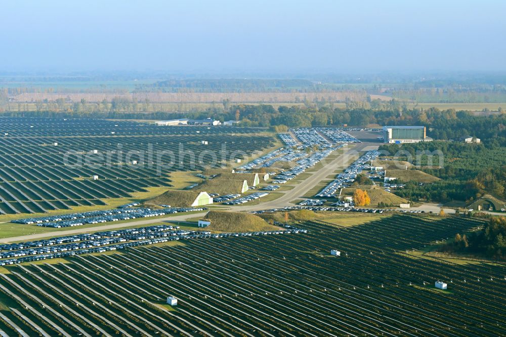 Aerial image Neuhardenberg - New car parking areas of the automobile manufacturer TESLA at the solar power plant and photovoltaic systems on the runway and taxiway area of the airfield in Neuhardenberg in the federal state of Brandenburg, Germany