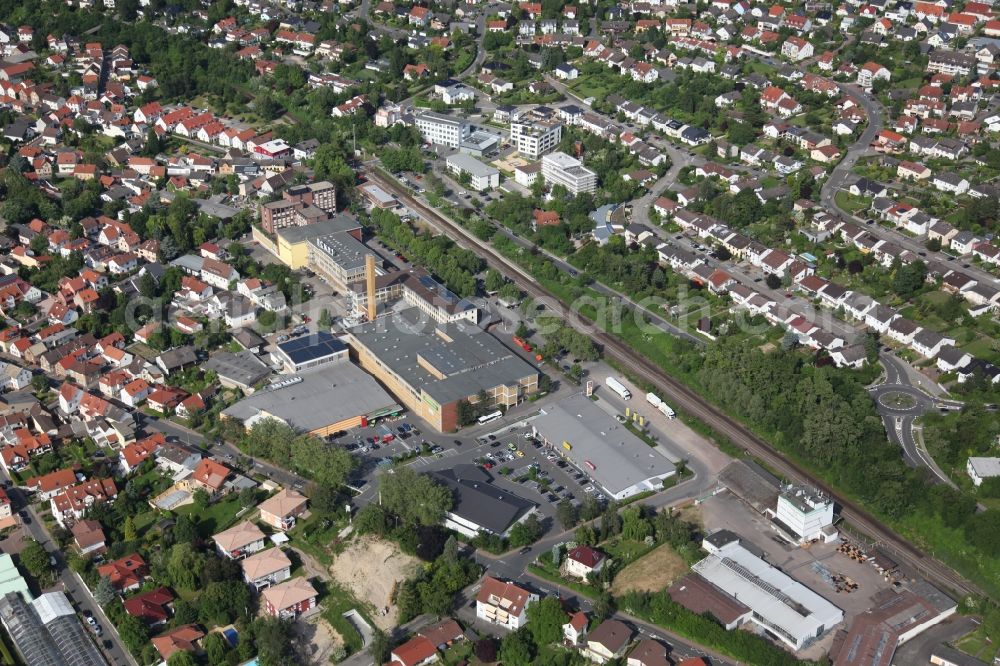 Aerial photograph Nieder-Olm - Local View of Nieder-Olm in Rhineland-Palatinate, at the center the factory of the manufacturer of beverages Eckes