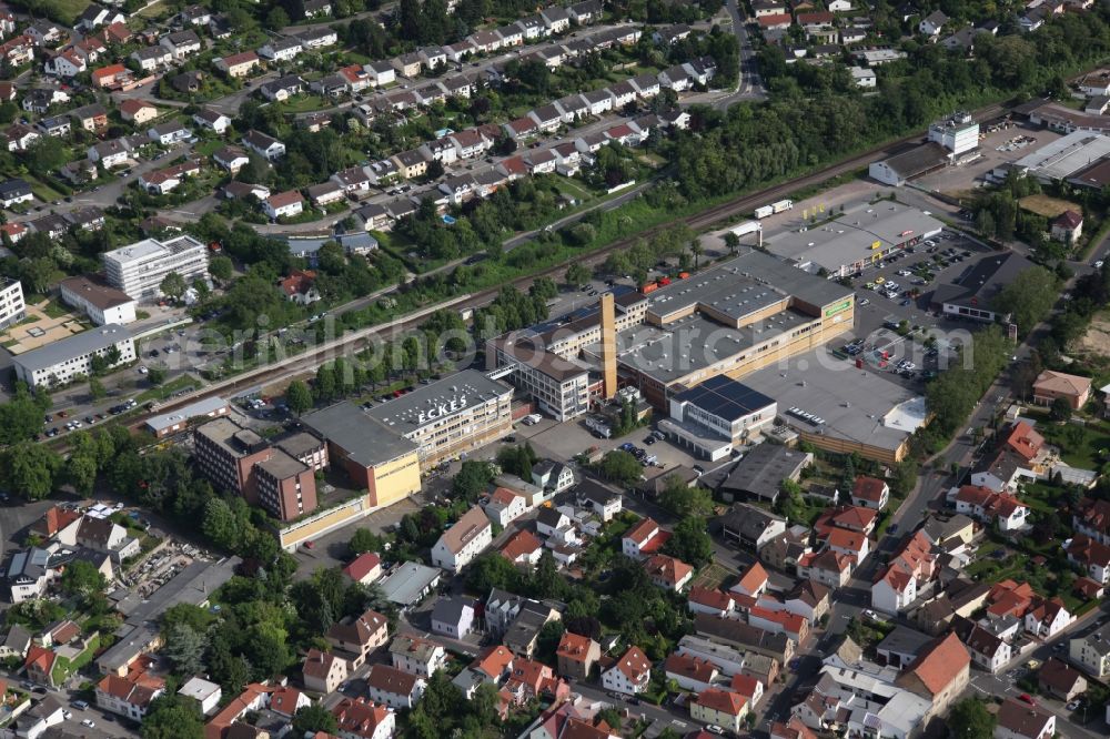 Nieder-Olm from the bird's eye view: Local View of Nieder-Olm in Rhineland-Palatinate, at the center the factory of the manufacturer of beverages Eckes