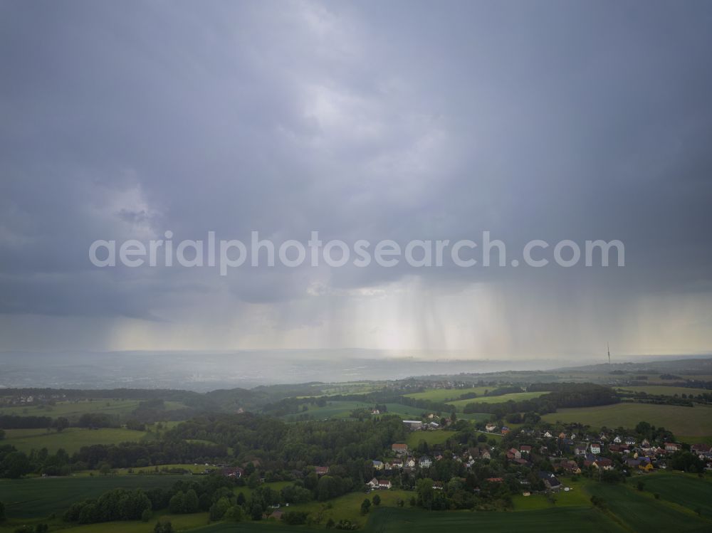 Dresden from the bird's eye view: Rain clouds with falling precipitation for the natural irrigation of the agricultural fields on street Zum Triebenberg in Dresden in the state Saxony, Germany