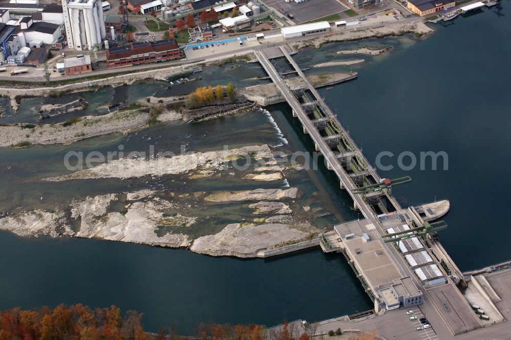 Aerial photograph Rheinfelden (Baden) - Low Tide at the weir on the river Rhine hydropower plant in Rheinfelden (Baden) in the state of Baden-Wuerttemberg. The rock structures below the weir, the Gwild, is irrigated with a certain amount of water and also the water drain at the fish ladder reduces the useable water flow for electricity generation