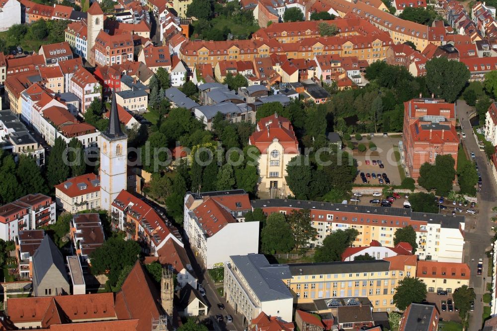 Aerial image Erfurt - The striking Nicholas Tower, the remainder of the Nikolai Church, is in the living quarters - on the hill - in Erfurt in Thuringia. On the ground floor of the tower, which is an important cultural monument of the city, is the Elizabeth Chapel. In the course of Augustinerstrasse a former Augustinian monastery, which is seen at the bottom of the screen follows. It was here Martin Luther as a young monk. Apart from the church tower in the Art Nouveau style villa has the Arts and Crafts School Erfurt, now part of the University, are located here