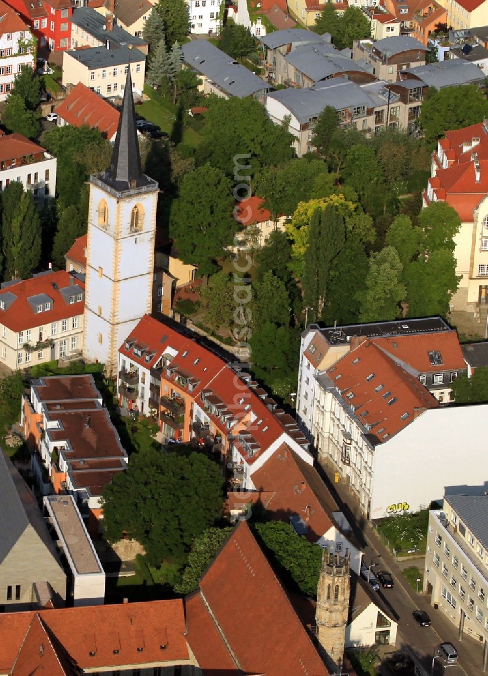 Aerial photograph Erfurt - The striking Nicholas Tower, the remainder of the Nikolai Church, is in the living quarters - on the hill - in Erfurt in Thuringia. On the ground floor of the tower, which is an important cultural monument of the city, is the Elizabeth Chapel. In the course of Augustinerstrasse a former Augustinian monastery, which is seen at the bottom of the screen follows. It was here Martin Luther as a young monk