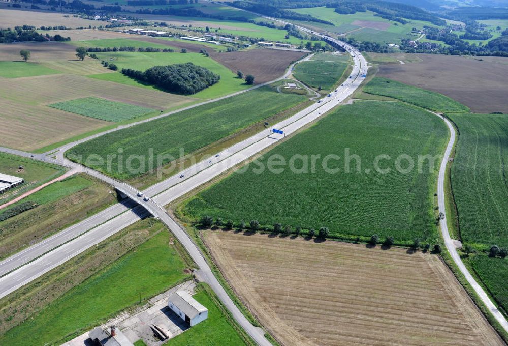 Hastrungsfeld from the bird's eye view: Neuer A4 Autobahnabschnitt, erbaut im Zuge des Projekt Nordverlegung / Umfahrung Hörselberge der Autobahn E40 / A4 in Thüringen bei Eisenach. Durchgeführt wurden die notwendigen Arbeiten unter an derem von den Mitarbeitern der Niederlassung Weimar der EUROVIA Verkehrsbau Union sowie der Niederlassungen Abbruch und Erdbau, Betonstraßenbau, Ingenieurbau und TECO Schallschutz der EUROVIA Beton sowie der DEGES. Construction of new bypass system.