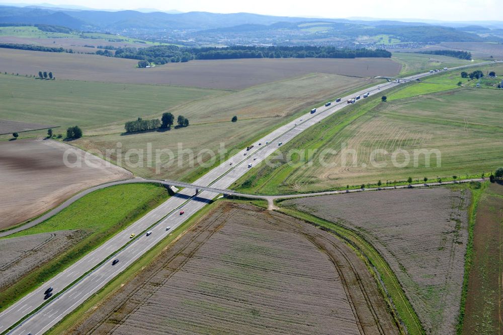 Neukirchen from above - Neuer A4 Autobahnabschnitt, erbaut im Zuge des Projekt Nordverlegung / Umfahrung Hörselberge der Autobahn E40 / A4 in Thüringen bei Eisenach. Durchgeführt wurden die notwendigen Arbeiten unter an derem von den Mitarbeitern der Niederlassung Weimar der EUROVIA Verkehrsbau Union sowie der Niederlassungen Abbruch und Erdbau, Betonstraßenbau, Ingenieurbau und TECO Schallschutz der EUROVIA Beton sowie der DEGES. Construction of new bypass system.