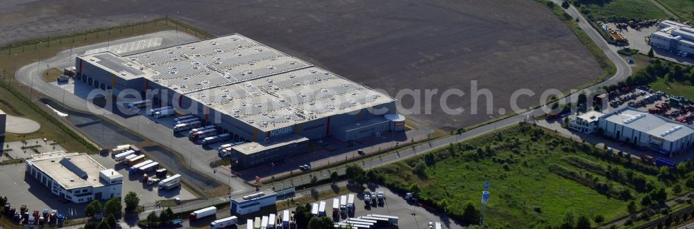 Aerial image Magdeburg - Norma Logistics centre in Magdeburg in the state of Saxony-Anhalt. The logistics centre of the discount store company is located on Woermlitzer Strasse in the commercial area North of Magdeburg. It is surrounded by fields and other company buildings