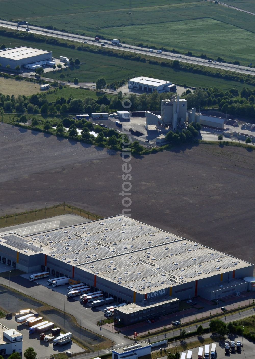 Magdeburg from above - Norma Logistics centre in Magdeburg in the state of Saxony-Anhalt. The logistics centre of the discount store company is located on Woermlitzer Strasse in the commercial area North of Magdeburg. It is surrounded by fields and other company buildings