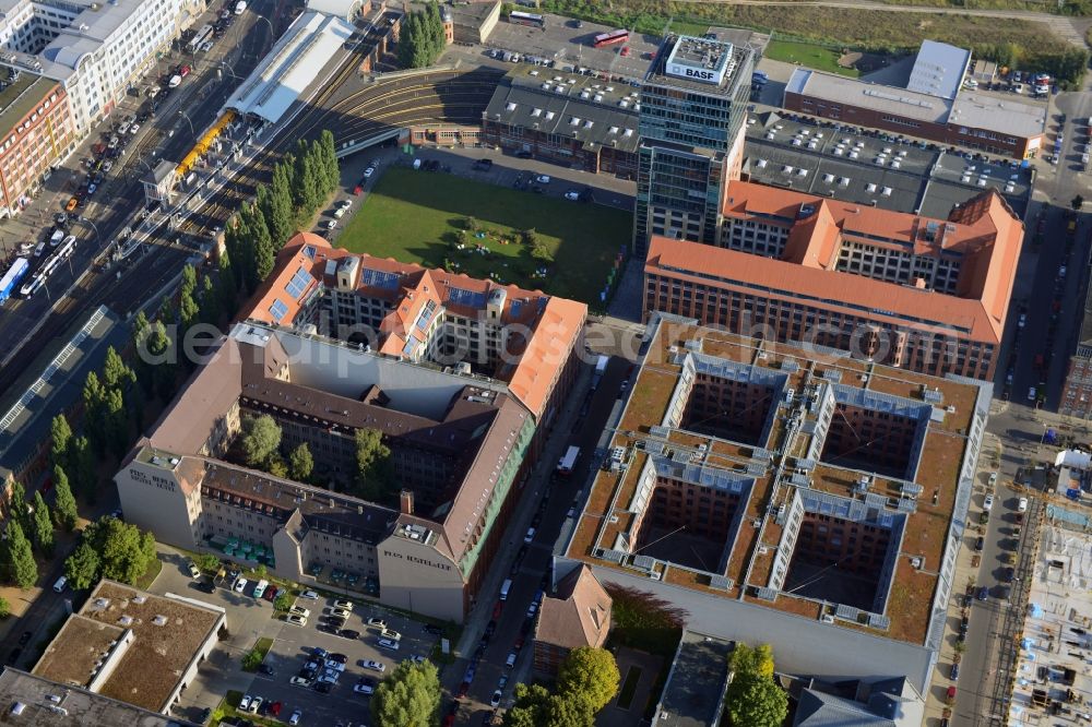 Aerial image Berlin - View at the restored building of the monument protected former Osram respectively Narva company premises Oberbaum City in the district Friedrichshain in Berlin. Here, among many other companies, BASF Services Europe, the German Post Customer Service Center GmbH and Heineken Germany GmbH are located. It is owned by HVB Immobilien AG, which is part of the UniCredit Group