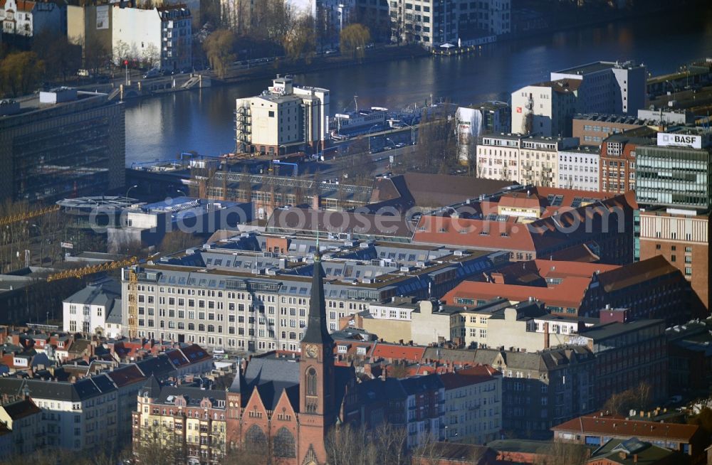 Aerial photograph Berlin - View at the restored building of the monument protected former Osram respectively Narva company premises Oberbaum City in the district Friedrichshain in Berlin. Here, among many other companies, BASF Services Europe, the German Post Customer Service Center GmbH and Heineken Germany GmbH are located. It is owned by HVB Immobilien AG, which is part of the UniCredit Group